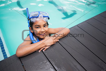 Cute little girl smiling in the pool
