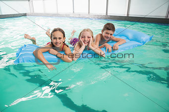 Cute little kids in the swimming pool