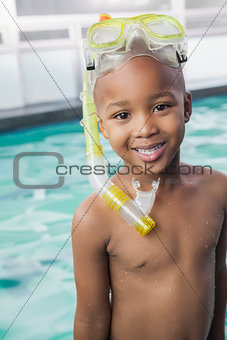 Cute little boy wearing snorkel and goggles