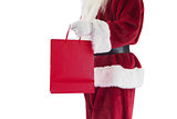 Santa carries red gift bag