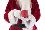 Santa holds a red cup