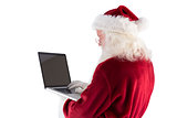 Santa Claus uses a laptop