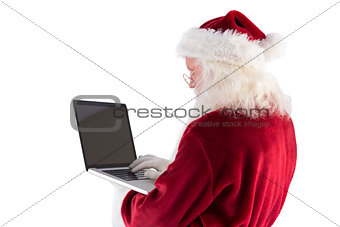 Santa Claus uses a laptop