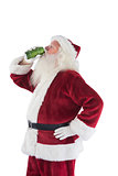 Father Christmas drinks beer with closed eyes