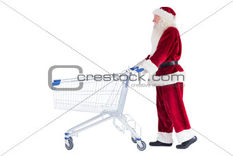 Santa pushes a shopping cart