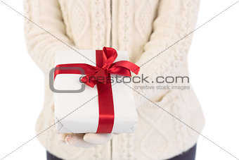 Close up of a festive woman offering gift