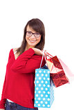 Smiling brunette holding shopping bags