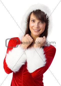 Cute brunette in santa claus smiling at camera