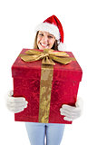 Festive young woman holding a gift