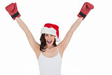 Festive brunette in boxing gloves cheering