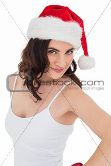 Portrait of a pretty brunette in santa hat