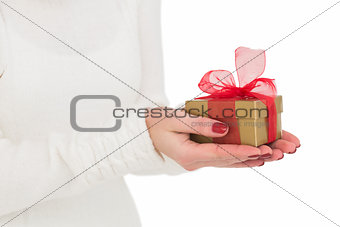 Pretty woman holding gild gift