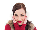 Brunette in winter clothes smiling at camera