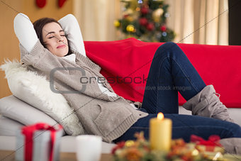 Brunette napping on the couch at christmas