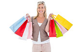 Happy blonde holding shopping bags