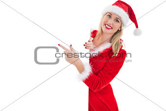 Festive blonde showing white card