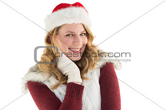 Festive blonde smiling in santa hat