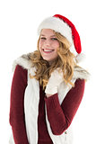 Blonde in santa hat smiling at camera
