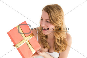 Cute blonde holding a gift