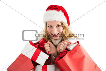 Girl in winter fashion holding presents and shopping bags