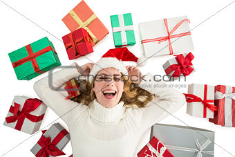Woman laying on the floor with gifts around her