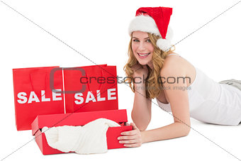 Festive blonde with sale shopping bags and present