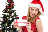 Blonde in santa hat holding a card