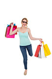 Happy blonde holding shopping bags
