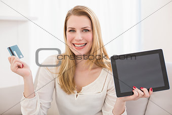 Pretty blonde shopping online with tablet
