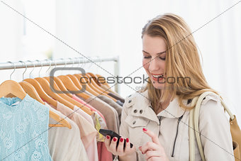 Pretty shopping blonde texting a message