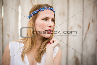 Blonde woman wearing headband looking away