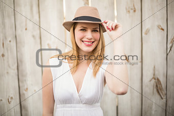 Portrait of a smiling blonde wearing hat