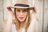 Close up of a blonde woman wearing hat