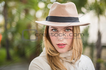 Cheerful blonde with hat posing