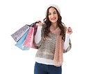 Brown hair in winter clothes holding shopping bags