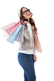 Brunette with glasses holding shopping bags