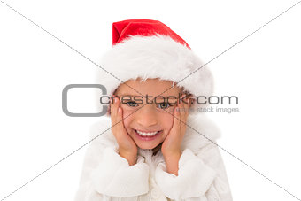 Cute little girl wearing santa hat