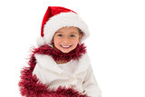 Cute little girl wearing santa hat and tinsel