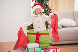 Cute little girl sitting in giant christmas gift
