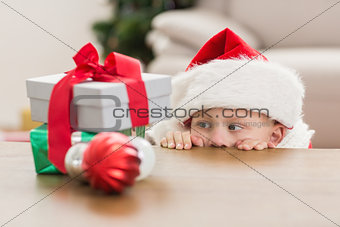 Festive little boy looking at gifts