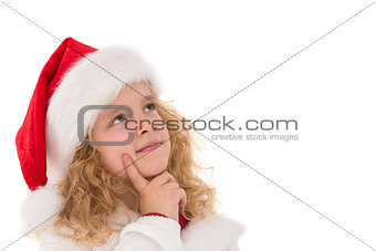 Festive little girl thinking and looking up