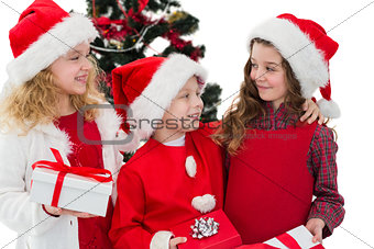 Festive little siblings holding gifts