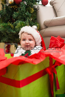 Cute baby boy in large christmas present