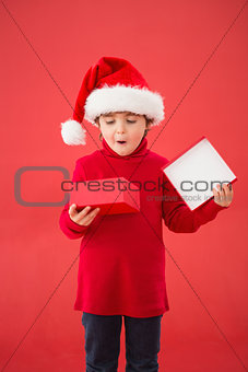 Festive little boy opening a gift