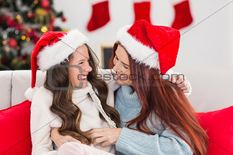 Festive mother and daughter on the couch