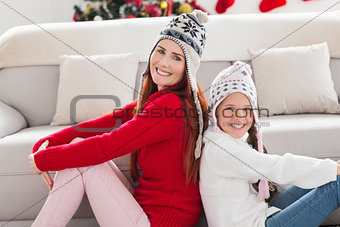 Mother and daughter smiling at camera
