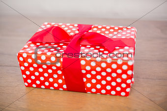 Red and white gift on table