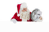 Santa holding a clock and sign