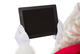 Santa claus using tablet pc
