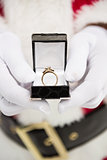 Close up of santa showing engagement ring